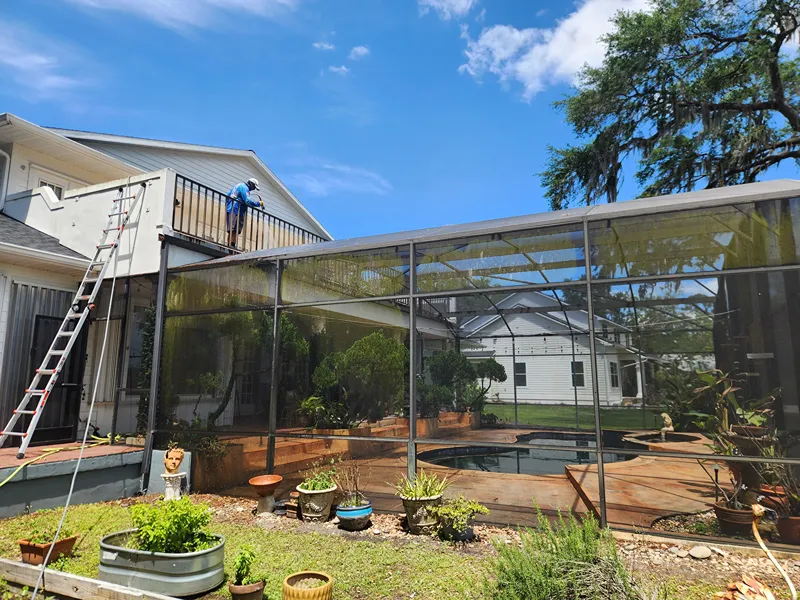 Pressure washing pool cage enclosure aluminum beams