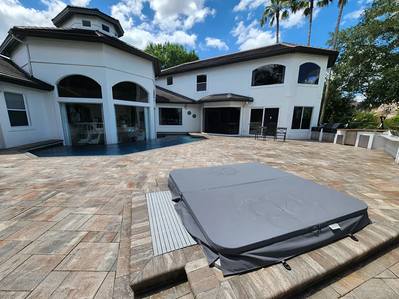 Restored luxury backyard space after pool patio pressure washing