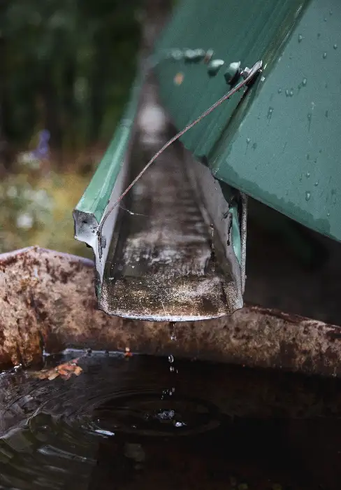 Central Florida seamless gutter draining rainwater during a typical afternoon storm